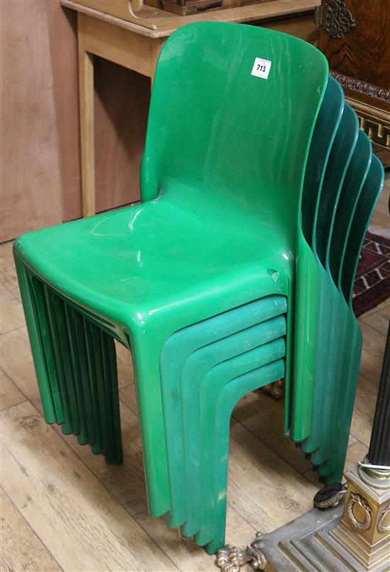 Five Artemide Selene green acrylic stacking chairs